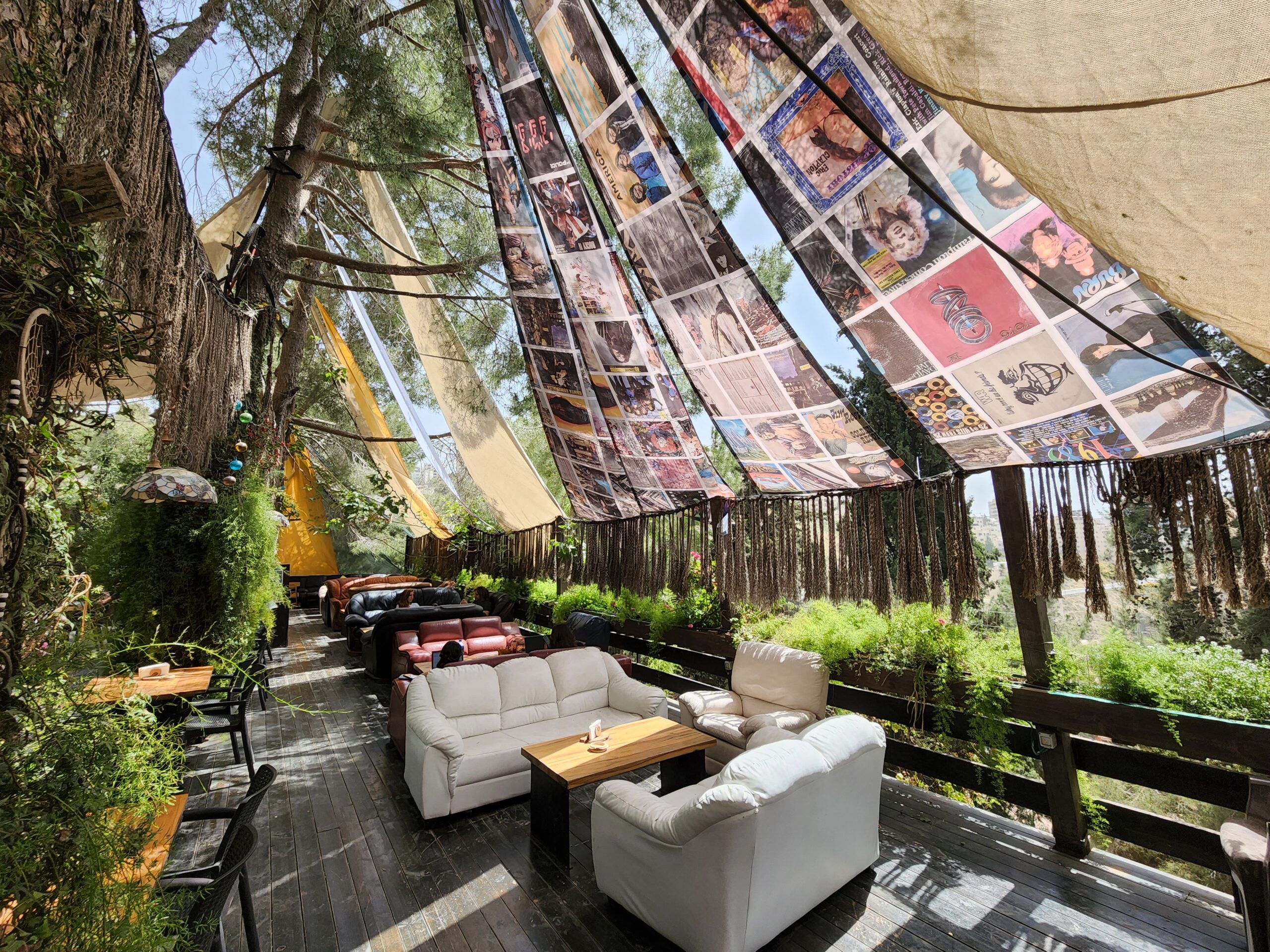 Snowbar garden lounge beneath the pine trees, photographed in 2022